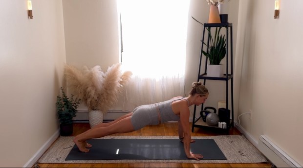 Personal trainer and Pilates instructor demonstrating push-ups