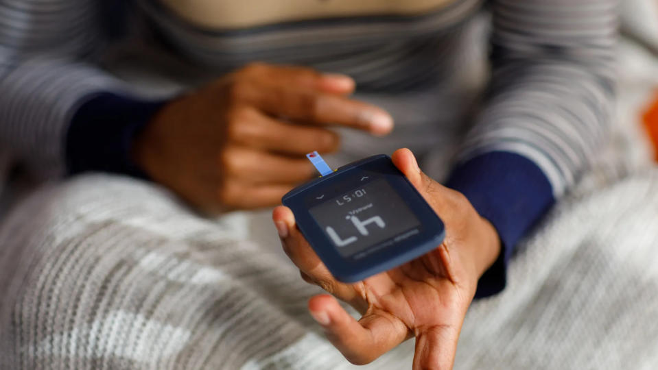 Woman checking glucose level