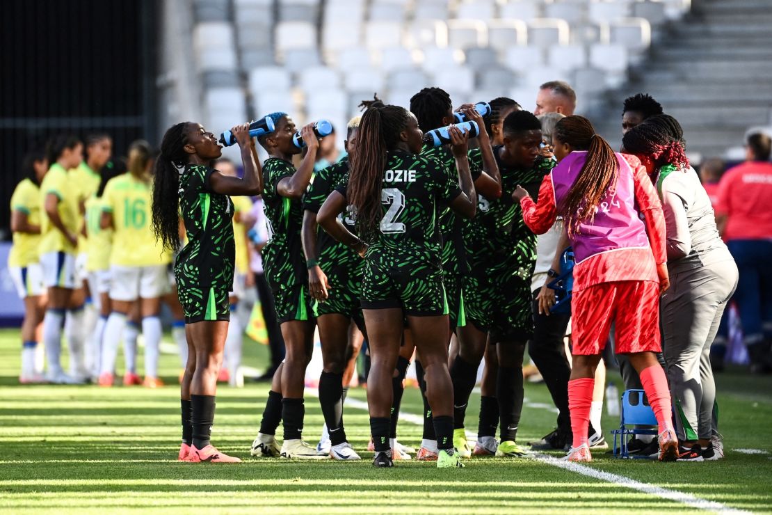 Hydration is key for athletes.  Here, the Nigerian women's soccer team takes a water break during a July 25 match against Brazil in Bordeaux, France during the 2024 Olympic Games.