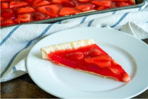 strawberry slab pie that's as easy to make as it is beautiful! With a crisp pie crust, fresh strawberries, and a luscious strawberry jello filling